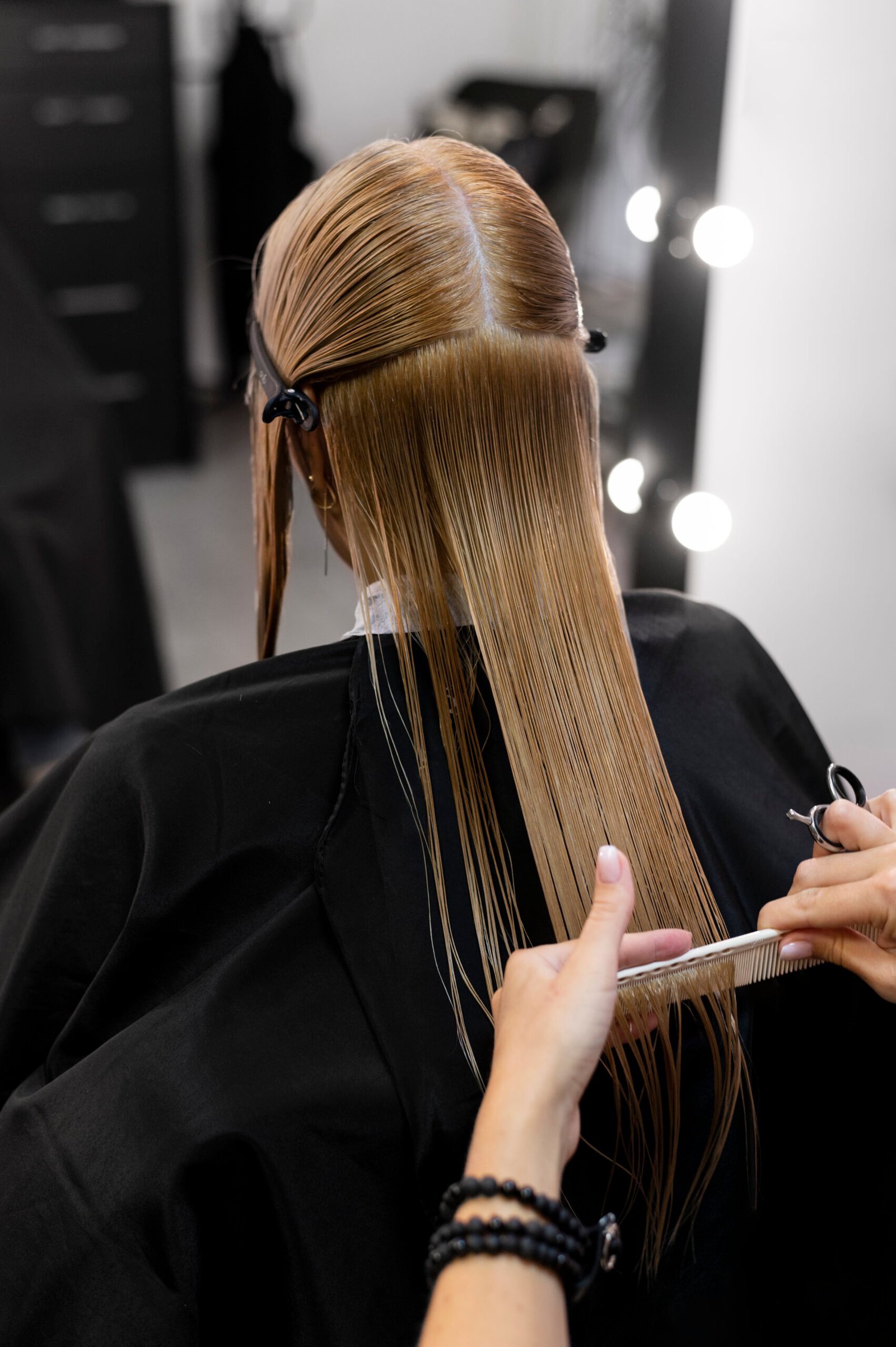 woman-getting-her-hair-cut-beauty-salon